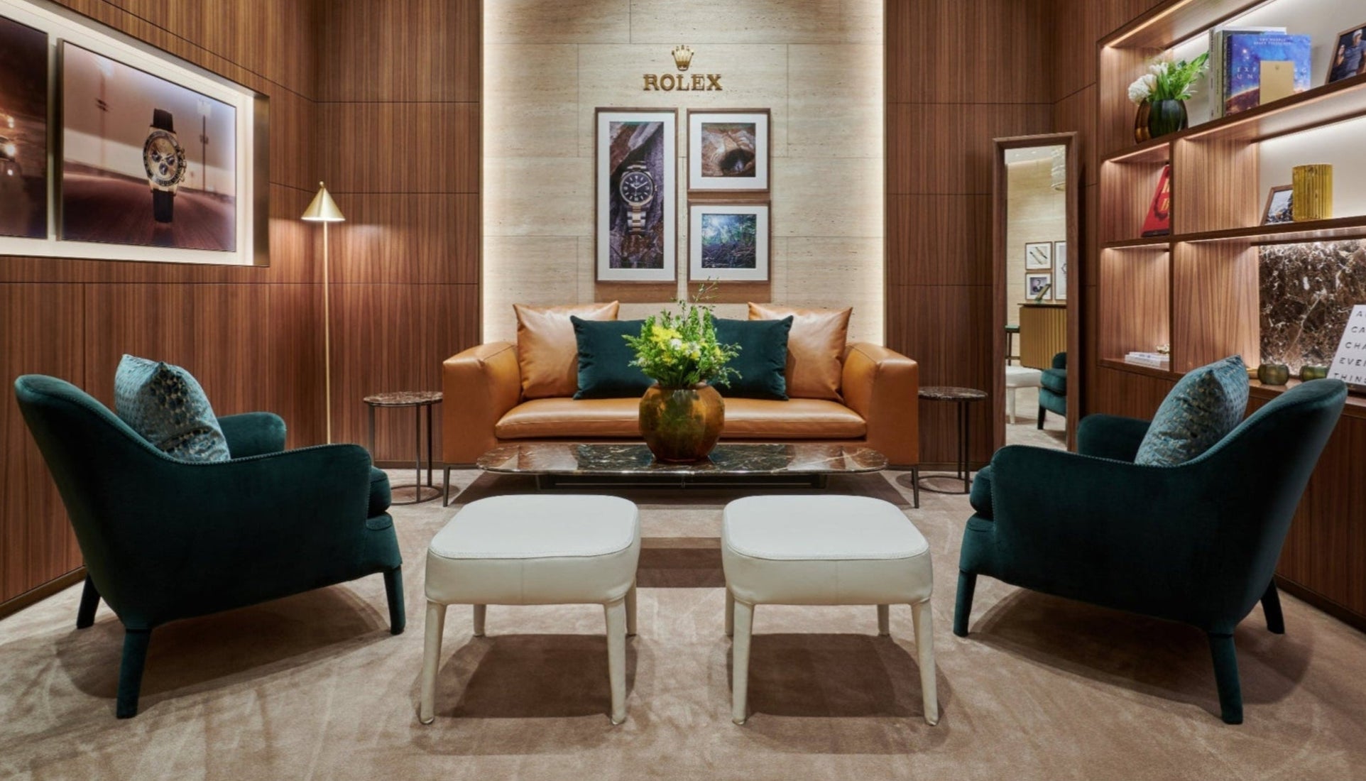 Luxuriously decorated Rolex Boutique showing room with lounge seating and gallery lighting at Somerset Collection South