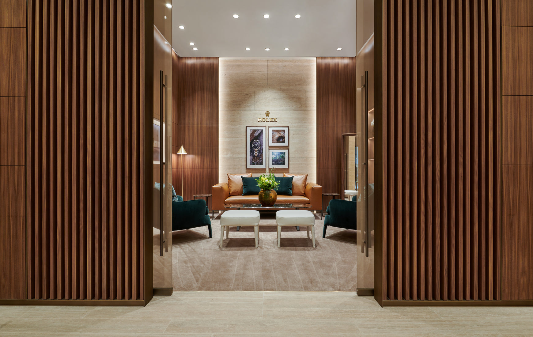 Symmetrical view of brown doorway to luxurious Rolex lounge viewing room at Rolex Boutique Detroit in Troy, MI at Somerset Collection South