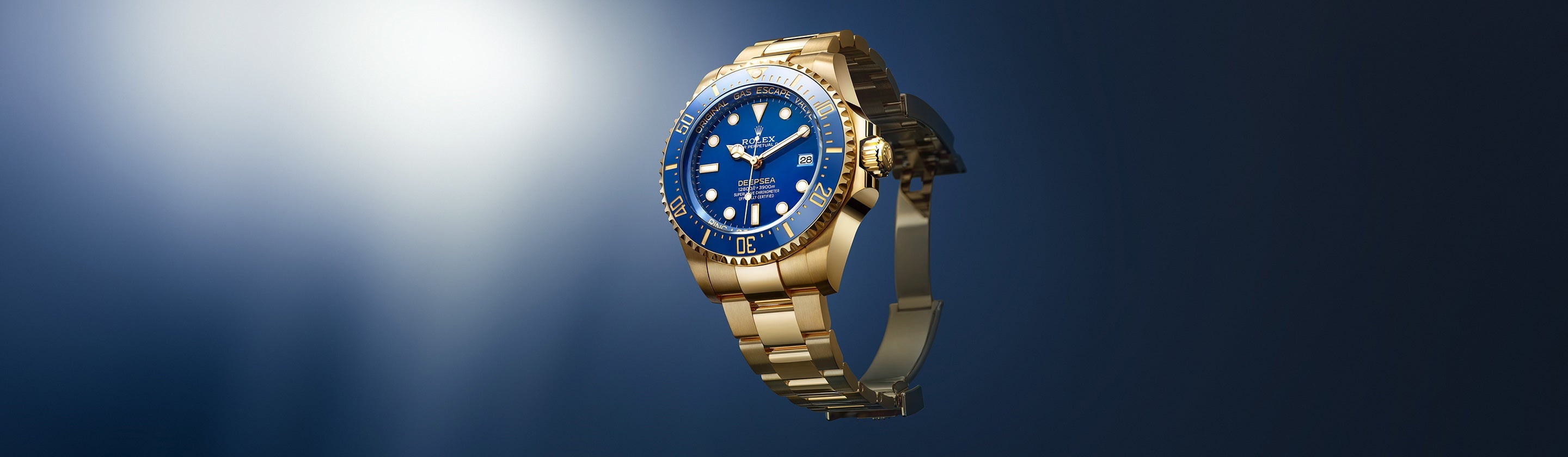 2024 Deepsea 18K Yellow Gold Blue Dial unlatched and suspended in air on 