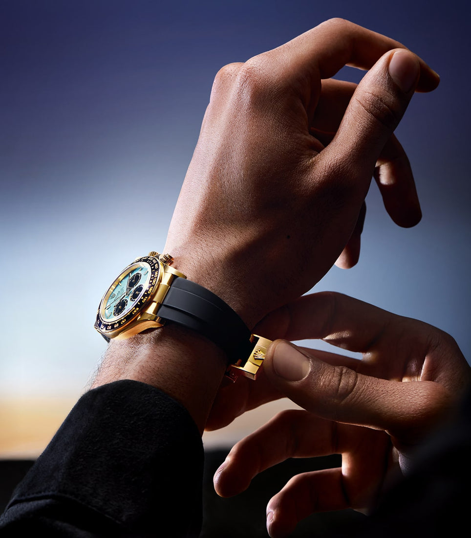 Man securing Rolex Cosmograph Daytona watch m126518ln-0014 on left wrist with right hand