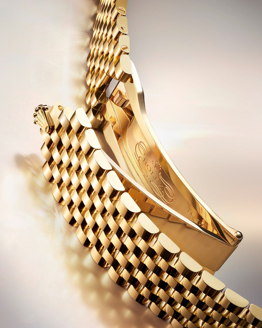 Close-up image of a Rolex watch featuring the Perpetual 1908 Settimo bracelet, highlighting the detailed craftsmanship and polished metal links.
