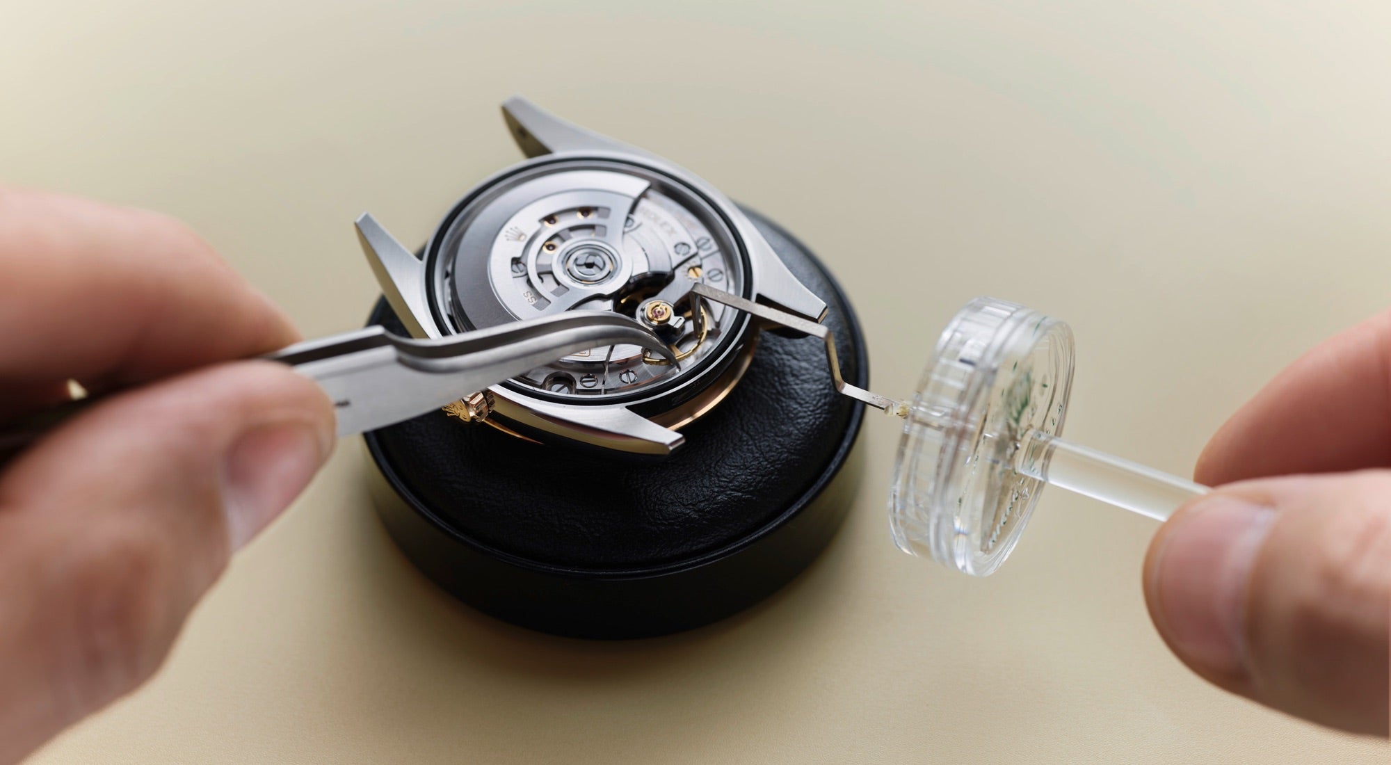 The image shows the performance control stage in Rolex's servicing procedure, featuring a close-up of a watch movement with a micro-stella balance wheel. This highlights Rolex’s precision in ensuring optimal watch accuracy and quality during servicing.