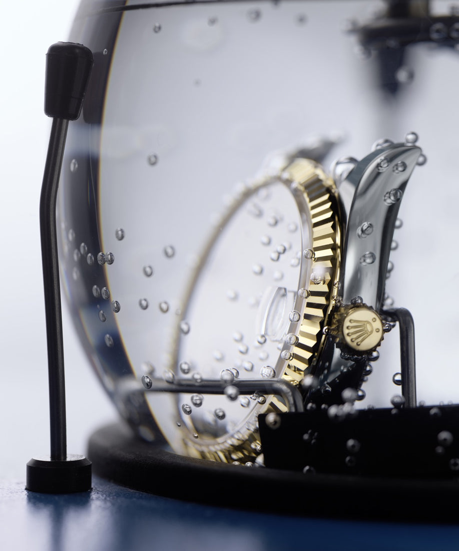 Water resistance control test using an etancheiscope device to verify the watch case seal integrity and ensure compliance with Rolex's stringent water-resistance standards during servicing.